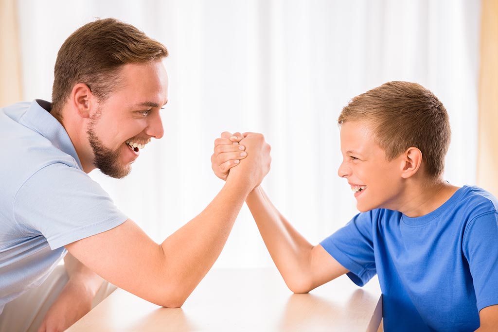 Big and little arm wrestling